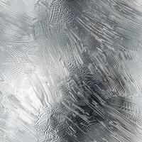 A minimalist abstract backdrop featuring a silver texture that creates a sense of depth with its intricate patterns, ideal for modern design and artistic applications photo