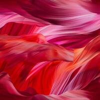 Bold streaks of red and pink flow across the canvas, evoking the beauty of natural formations. The colors blend seamlessly, creating a mesmerizing visual experience photo