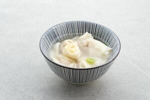 Yummy Wonton Soup or dumpling soup or Pangsit Kuah, served in bowl. photo