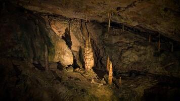 Illuminated Dark Rocky Stone Dripstone Caves Stalactite Background video