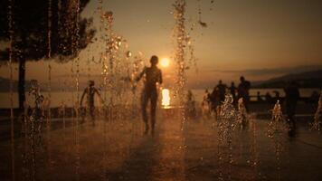Sunset Play Capturing Joyful Moments and Happiness at the Beautiful Fountain Site video