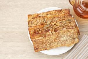 Sale Pisang Keju, made from bananas that are cut into thin strips, dried in the sun, then fried in flour. Indonesian traditional snack photo