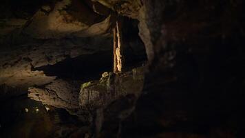 Illuminated Dark Rocky Stone Dripstone Caves Stalactite Background video