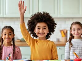 A cheerful child raising a hand in a classroom setting with classmates and colorful art supplies. photo