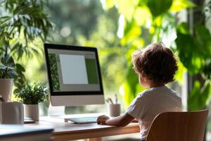 Child focused on a computer at home, surrounded by green plants and natural light. photo