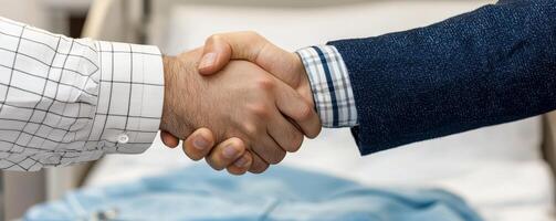 Handshake between two people, symbolizing agreement and partnership. photo