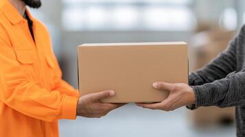 Delivery person handing a cardboard package to another person, indoor environment. photo