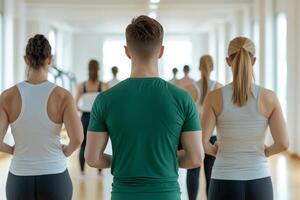 Group of people practicing yoga in a bright studio. photo