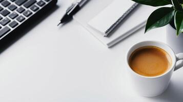 Coffee cup, plant, and workspace items on a clean desk, white isolate background. photo