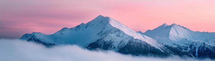 Majestic mountains above clouds during sunset with a pastel sky. photo
