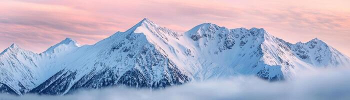 Snowy mountain peaks under a colorful sky, picturesque winter scenery photo
