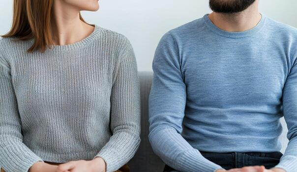 Two individuals engaged in a deep conversation, focused and attentive. photo