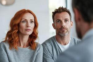 Two focused individuals engaged in a serious conversation. photo
