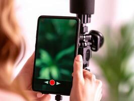 Smartphone capturing in a modern setting, blurred background. photo