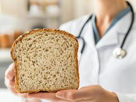 Health professional holding a slice of whole grain bread. photo