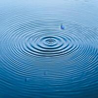 Ripples in blue water create a calming and serene effect on the surface. photo