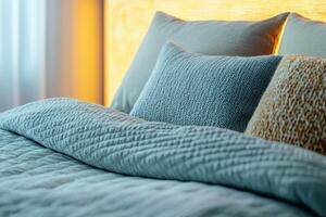 Cozy bedroom scene with soft pillows and blanket in peaceful tones. photo