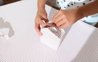 Gift Wrapping with Polka Dot Paper photo