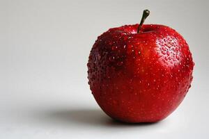 Fresh Red Apple with Water Droplets on White Background - Ideal for Healthy Eating Concepts and Food Photography photo