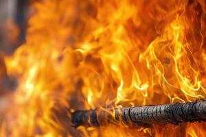 A Close-Up View of a Charred Log Burning in a Fiery Blaze photo