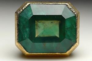 A Close-Up View of a Large Emerald Gemstone Set in Gold photo