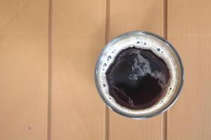 A cup of coffee on a wooden table photo