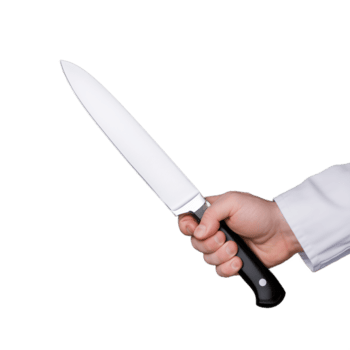 de cerca de un mano agarre un agudo cocina cuchillo con un negro encargarse de en un transparente fondo, simbolizando culinario precisión y controlar png