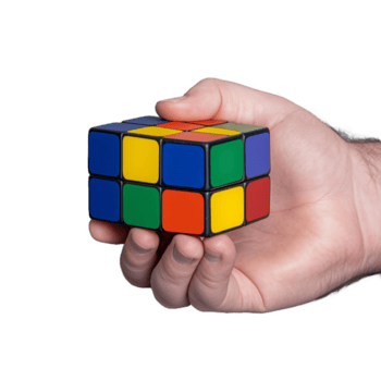 main en portant une coloré puzzle cube à vitrine intelligence et problème résolution sur une transparent Contexte png