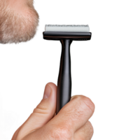 Close up of a man's hand holding grooming razor with beard in focus on transparent background png