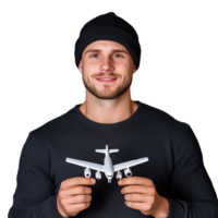 Smiling man wearing a beanie holding a model airplane on a transparent background epitomizing travel dreams and aspirations png