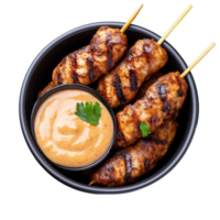 Delicious grilled chicken skewers with spicy sauce in a bowl png