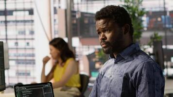 Data scientist developing and maintaining machine learning APIs solving complex problems. Man training predictive models capable of handling tasks such as language processing, camera A video