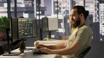 Developer working with artificial intelligence machine learning tech, improving company systems. IT expert in office focused on transforming data into predictive models, camera A video