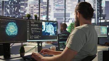 Software technician using computer for artificial intelligence computing simulating human brain. Close up of employee working with AI deep neural networks on desktop PC, camera B video