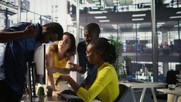 Upset IT workers in office debating, doing brainstorming, looking through lines of code on computer. Team of company employees discussing in workspace, disagreeing with each other, camera B video