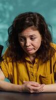 Vertical Streamer feeling tired after doing marathon live broadcast, talking to audience. Fatigued media star feeling sleepy after spending many hours talking with viewers, camera A video