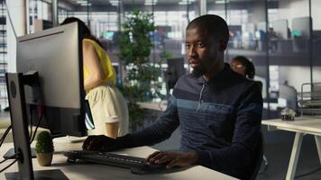 Portrait of happy programmer working with machine learning artificial intelligence critical to autonomous systems. Upbeat software engineer transforming data into predictive models, camera B video