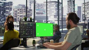 Computer scientist using isolated screen PC to create machine learning models that can process data to automate decision making processes. IT specialist programming using chroma key computer, camera B video