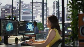 Admin developing artificial intelligence machine learning APIs solving complex problems. Woman training AI predictive models capable of handling resource intensive tasks, camera B video