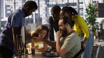 Programmers gathered together to conduct code review to fix errors, identifying technical issues with company software. Team of developers doing brainstorming, optimizing code, camera A video