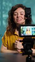 Vertical Content creator filming technology review of different electronics, unboxing them and presenting specifications to audience. Media star showing product recommendations to subscribers, camera A video