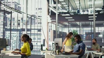 African american man designing, developing and maintaining software applications using various programming languages. System administrator debugging company servers, preventing failures, camera B video