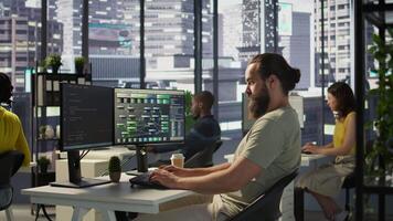 Developer working with artificial intelligence machine learning tech, improving company systems. IT expert in office focused on transforming data into predictive models, camera B video
