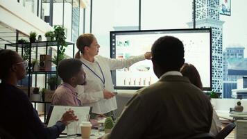 Executive board members meeting in conference room to establish future growth plan, ensuring expansion goals for the multinational company. Big data insights to make informed decisions. Camera B. video
