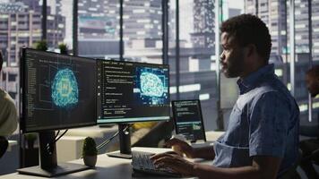 Data scientist working with machine learning artificial intelligence technology critical to autonomous systems. IT professional working with AI tech to transform data into predictive models, camera B video
