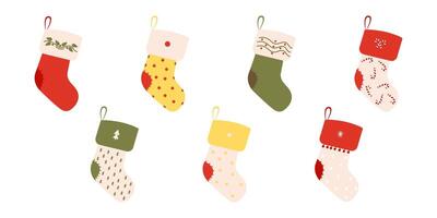 Set of winter New Year's socks. Flat clothing element and attributes of winter celebration with different designs, patterns, colors and drawings. Festive colorful stockings. vector