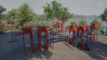 Playground structure surrounded by trees near a serene lake in broad daylight video