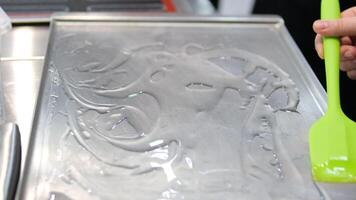 grease a baking sheet Greasing baking tray covered with baking paper with oil using a brush. Close up. video