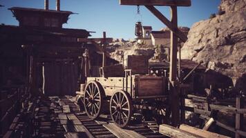 Abandoned wooden wagon on a weathered path in a deserted mining town video