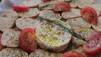 Delightful various types of white cheese and crispy fresh bread with pieces of wood on rustic table video